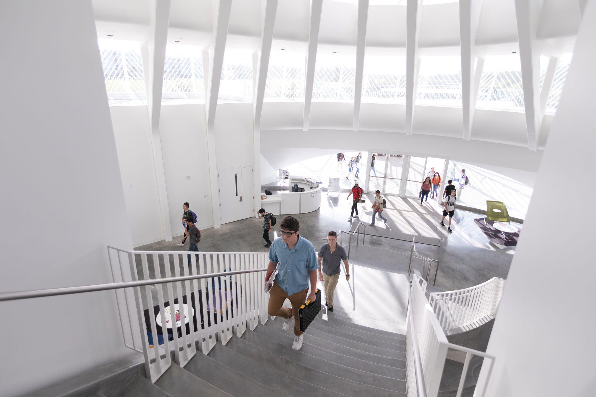 Students walking up stairs.