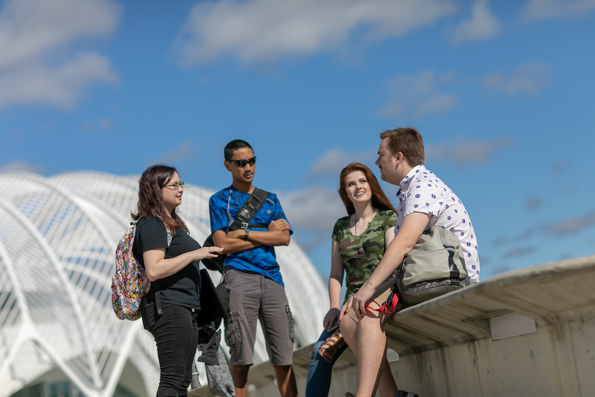 students talking outside