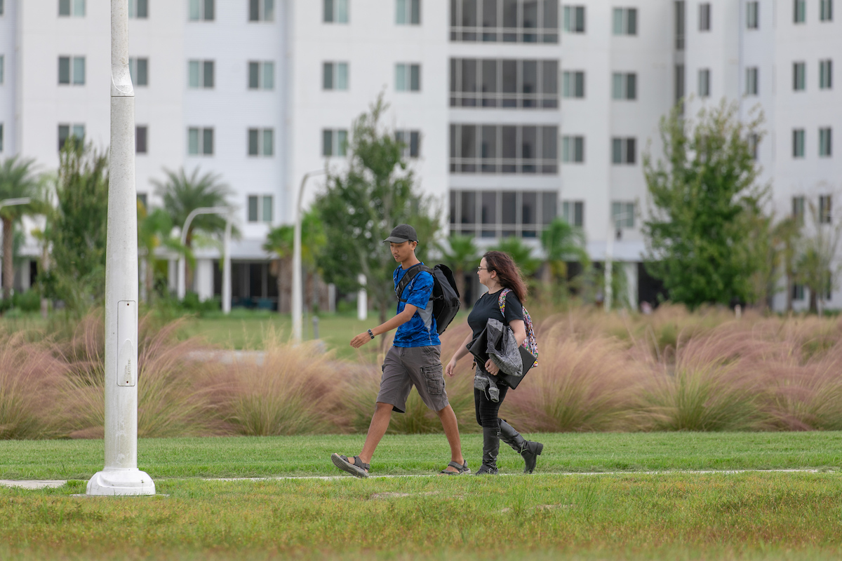 students walking in front of residence halls