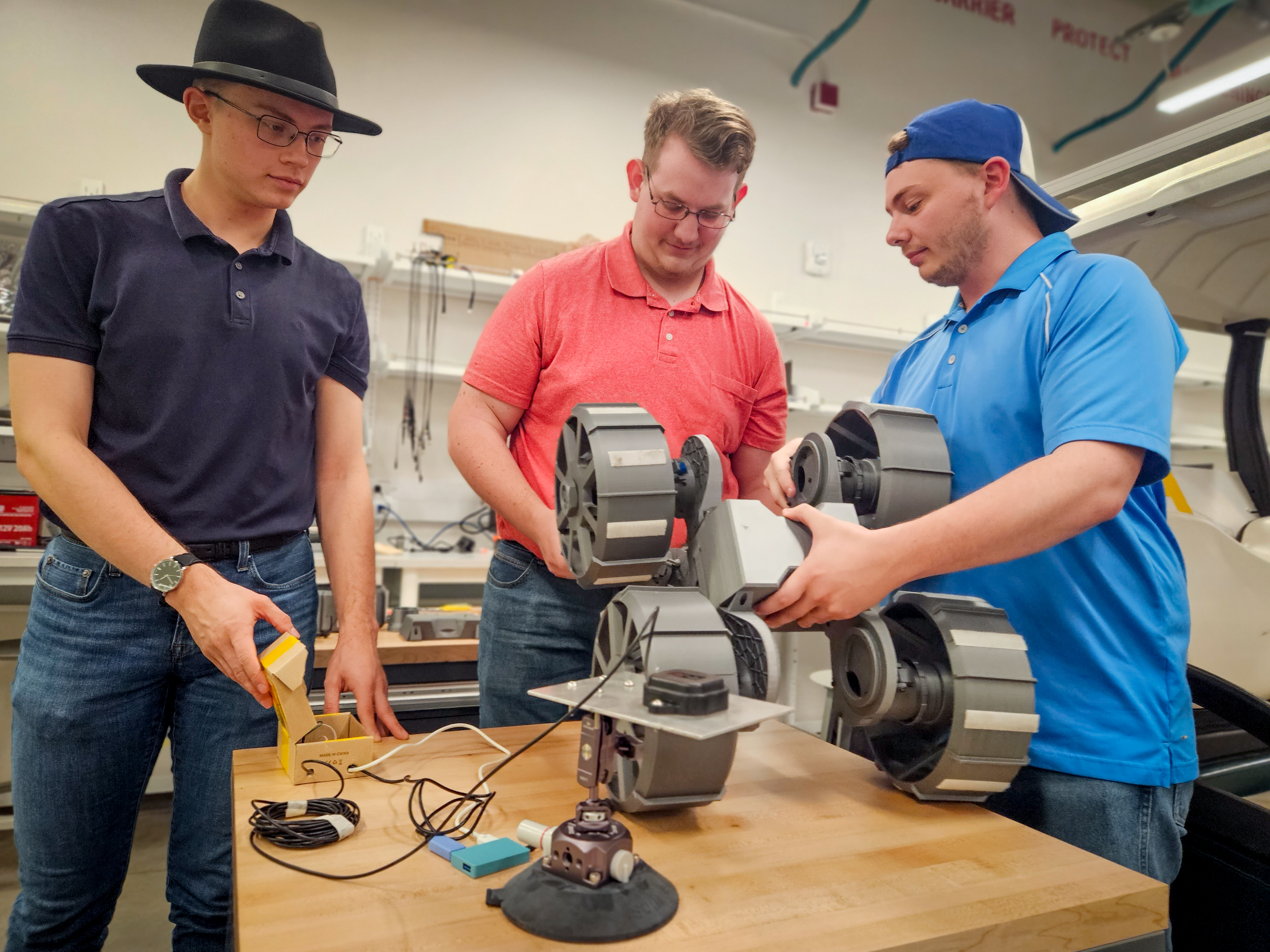 capstone team working on machine