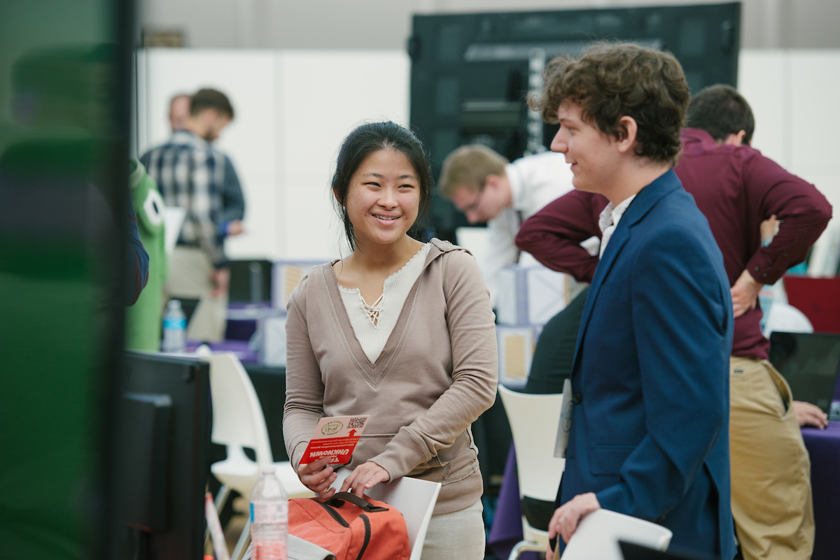 Students talking at Game Expo.