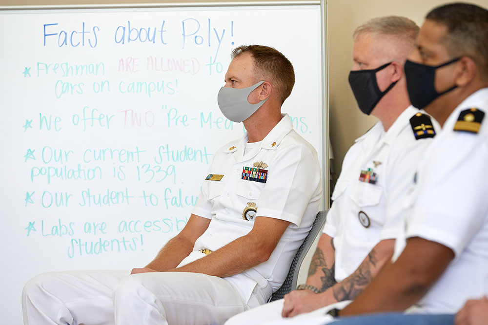 men in navy uniforms wearing masks
