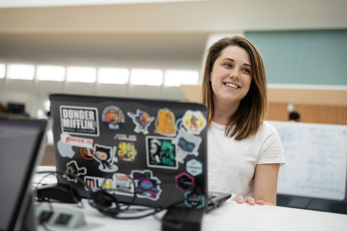 girl smiling at computer