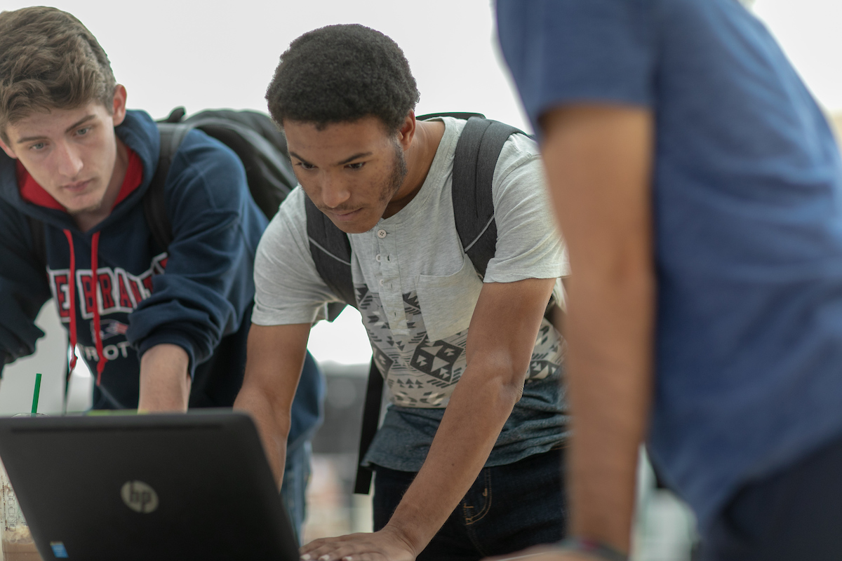 Students working at their laptops.