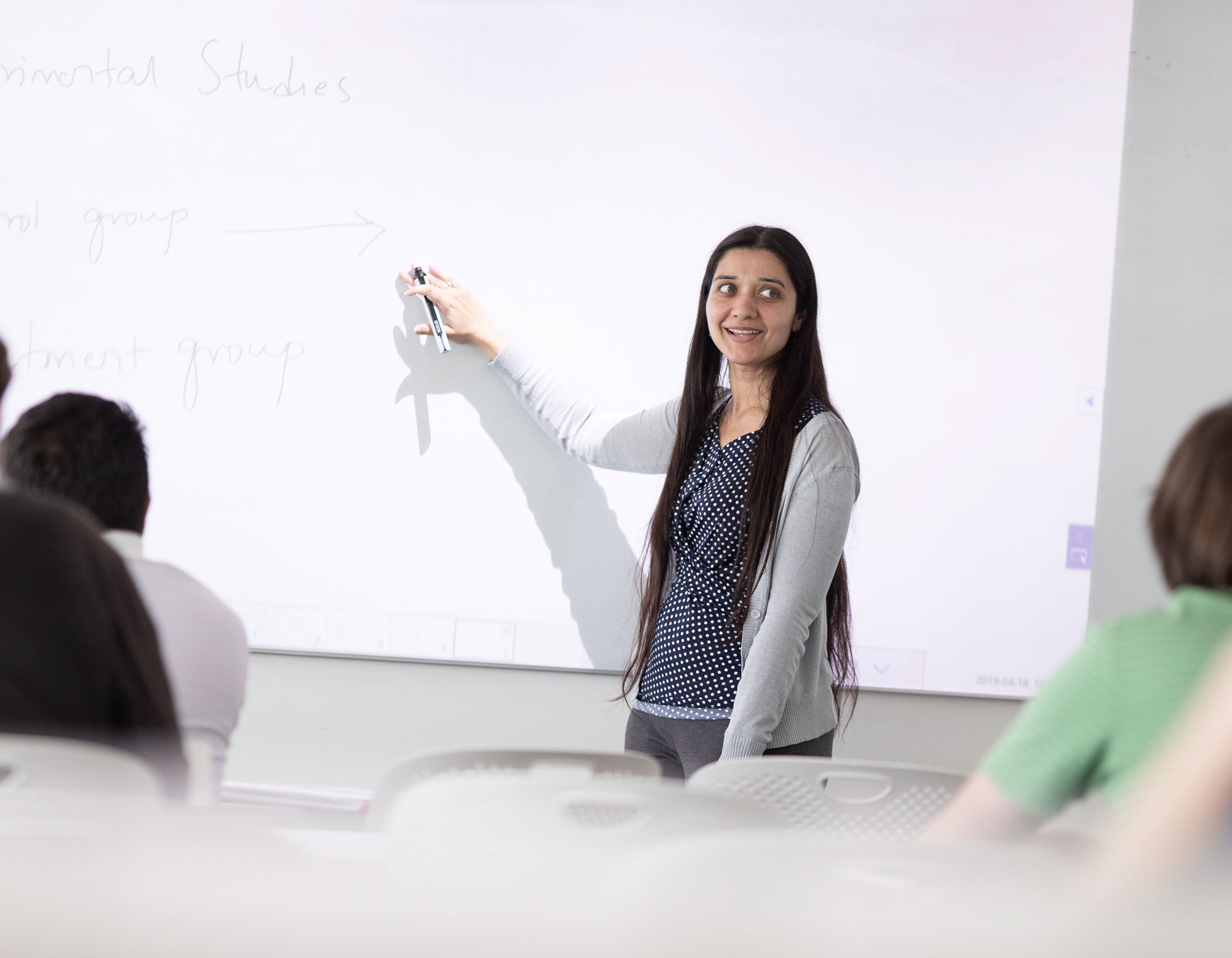 Light skinned women in classroom.